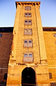 Facade of warehouse at dusk on Amaliehaven park, Larsens Plads, Copenhagen, Denmark