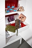 Various evening handbags in drawers