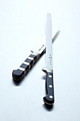 Two knives on white background