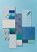 Various blue mosaic tiles scattered on blue background