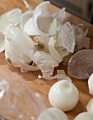 Close-up of boiled onions on wood