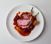 Veal with celery puree, beetroot, carrots and pumpkin gnocchi on plate, overhead view