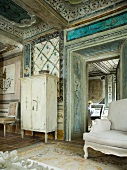 Painted ceiling and white sofa in Italian Palazzo