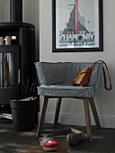 Chair with grey slipcovers and fur pillows with clogs