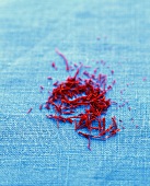 Close-up of saffron strands on blue background
