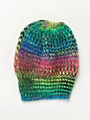 Bright neon coloured knitted hat on white background