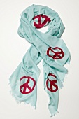 Turquoise colour pashmina cloth with pink peace sign on white background