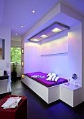 Solarium with bright lights and purple bed