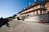 View of people at Schloss Hotel Pillnitz against blue sky, Saxony, Germany