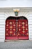 Entrance of red Baroque door in Gorlitz, Saxony, Germany