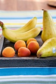 Close-up of bananas, pears and apricots