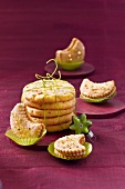 Close-up of mango-ginger cookies, marzipan and hazelnut monde