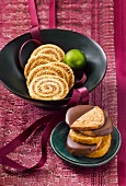 Close-up of nut wreath in bowl and chocolate cake on plate