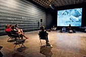 People sitting and listening sound at Whitney Museum of American Art, New York, USA