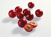 Plums on white background