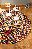 Side tables and fire truck on colourful pop art style carpet