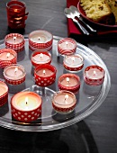 Tea light in glasses on tray