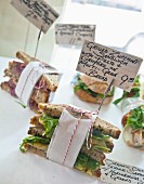Various sandwiches with price labels