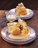 Close-up of apple dumpling with tonkabohne sauce on plate