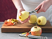 Removing core of peeled apple with core remover while preparing apple dumpling, step 1