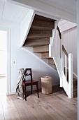 Spiral oak staircase with white painted railing