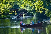 Tourist enjoying boating in citizen park, Bremen, Germany