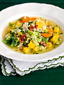 Close-up of swede stew with pearl barley and savoy cabbage on plate