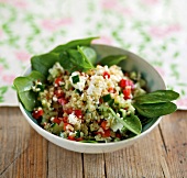 Bowl of bulgur salad with spinach