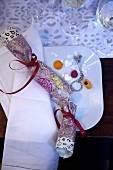 Crackers and various other confectioneries on white plate, overhead view