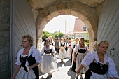 Procession on road in Franconian Switzerland, Bavaria, Germany