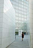 Woman at the entrance of Arab World Institute in Paris, France