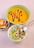 Pumpkin soup and pea soup with smoked tofu in bowls 