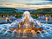 View of Latona Fountain at dusk in Versailles, France