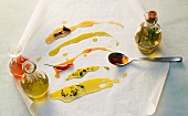 Various edible oils smeared on parchment paper