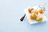 Jam tarts with butter paper on wire coaster