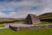 View of Gallarus Oratory and mountain in County Kerry, Ireland