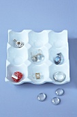 Egg cups converted to jewellery storage in white