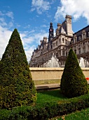 Topiary and fountain in front of Hotel de Ville in Paris, France