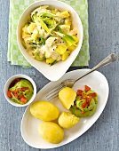 Bowl of cheese potatoes with leeks, boiled potatoes and avocado dip