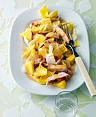 Chicory salad with turkey strips and pineapple on plate
