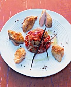 Quail breasts in chamomile oil with chestnut vegetables on plate