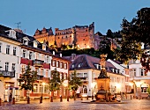 View of ruin of old castle and buildings at dusk in Heidelberg, Germany