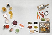 Different types of vegetables in bowl, plate and wooden board, overhead view 