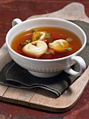 Tortellini with brodo in bowl