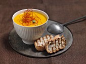 Carrot and orange soup with grilled bread