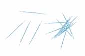 Close-up of blue toothpick on white background