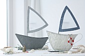 Lanterns in the shape of boats with maritime accessories