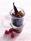 Glass of raspberry sauce and blueberry sauce with vanilla