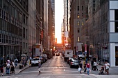 People at Fifth Avenue at 42nd Street at sunset, New York, USA