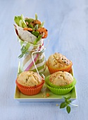 Wrap with pesto, shrimp and vegetables with muffins on square plate